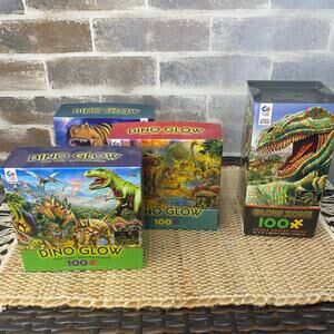 Four Puzzles Dino Glow Zone 100 piece puzzles Glow in the dark 2 New and 2 used